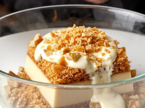 Golden crispy walnut kadayıf custard dessert in a baking dish