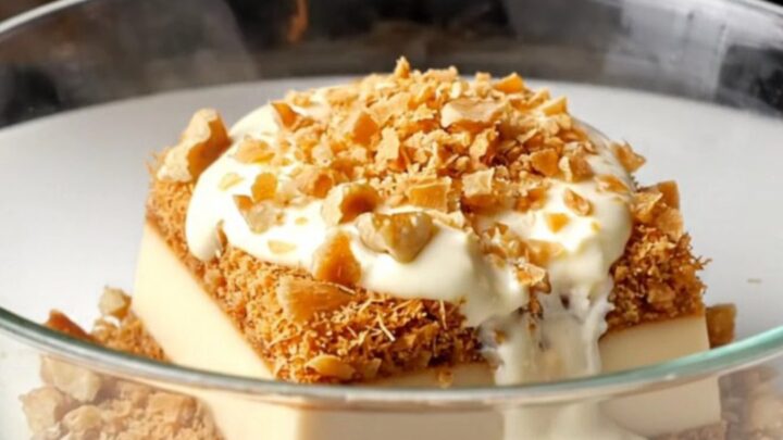 Golden crispy walnut kadayıf custard dessert in a baking dish