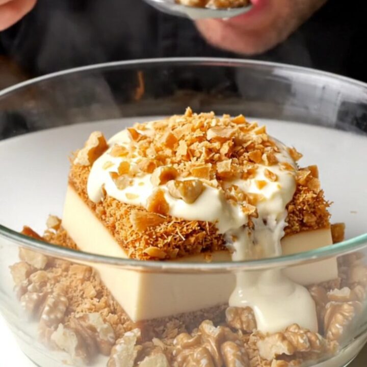 Golden crispy walnut kadayıf custard dessert in a baking dish