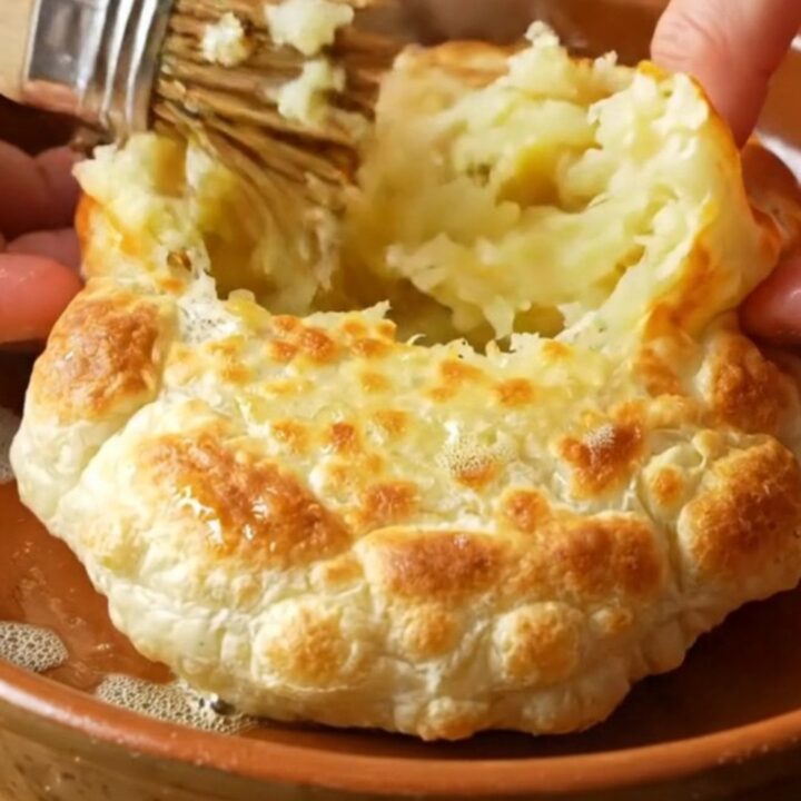 Golden potato bazlama flatbread torn open showing steamy spiced potato filling