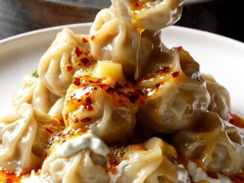 Plated mini meatballs with garlic yogurt and chili butter