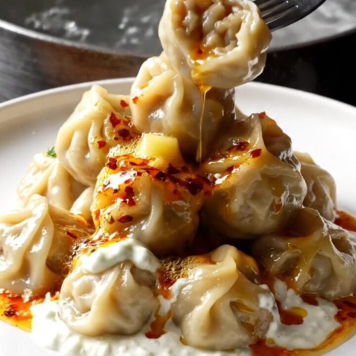 Plated mini meatballs with garlic yogurt and chili butter