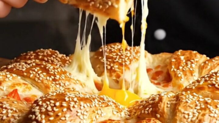 Golden crown ring pizza with sesame crust and melted cheese