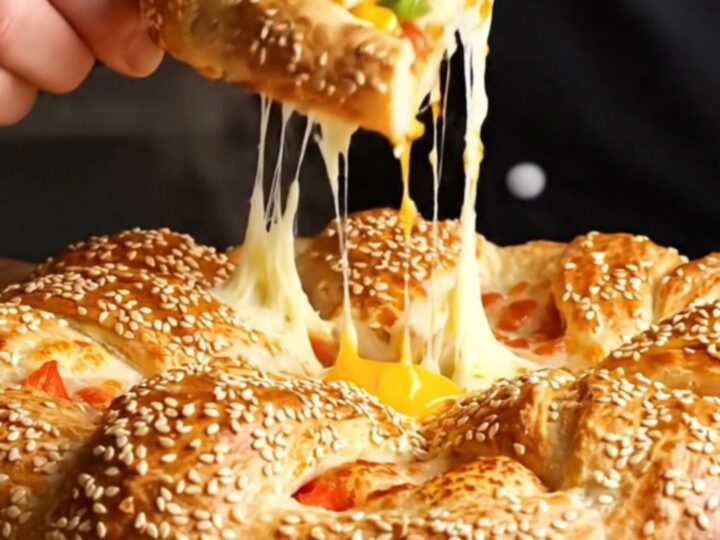Golden crown ring pizza with sesame crust and melted cheese