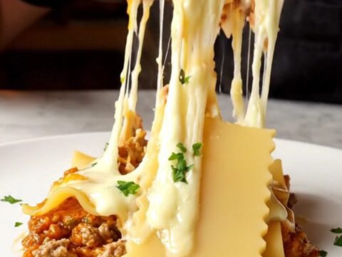 One-pan skillet lasagna with melted kaşar cheese and parsley, served in the skillet