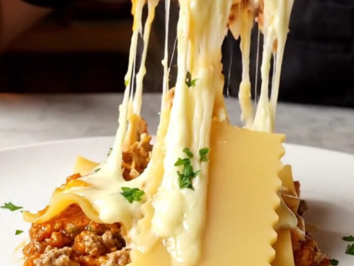 One-pan skillet lasagna with melted kaşar cheese and parsley, served in the skillet