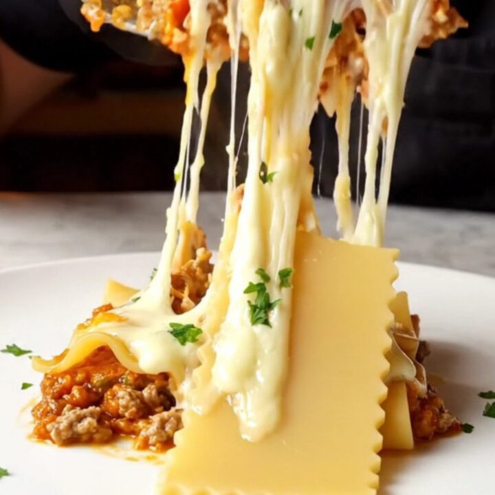 One-pan skillet lasagna with melted kaşar cheese and parsley, served in the skillet