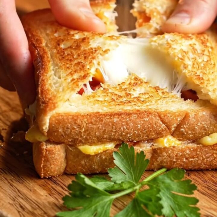 Golden crispy toast pocket cut open showing melted cheese and sucuk