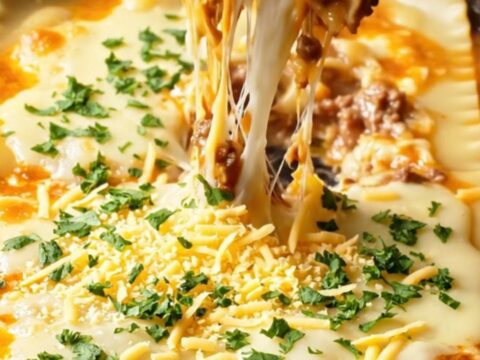 Golden skillet lasagna with melted cheese and parsley, ready to serve