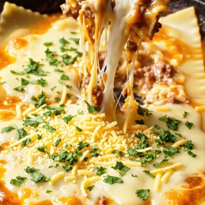 Golden skillet lasagna with melted cheese and parsley, ready to serve