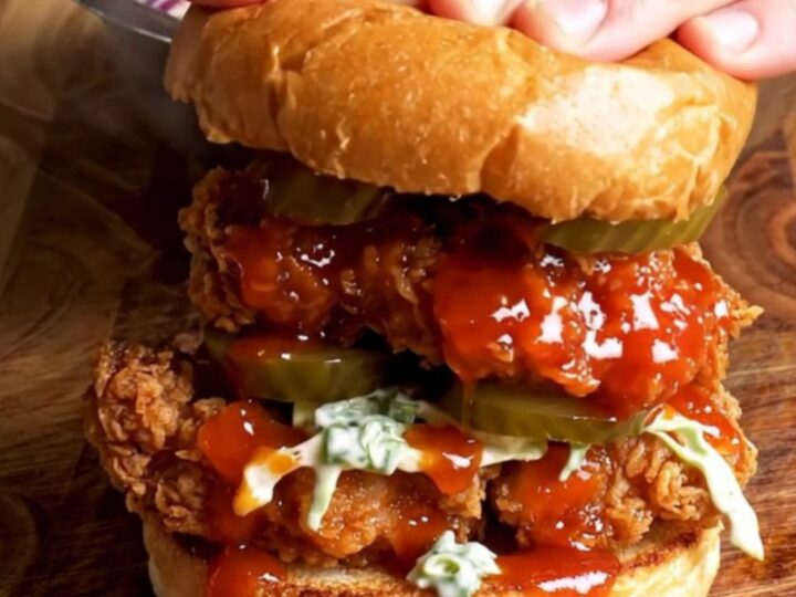 Nashville hot chicken sandwich with glazed chicken, ranch slaw, and pickles on a brioche bun