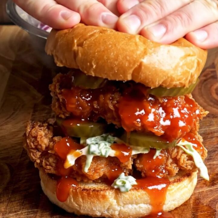 Nashville hot chicken sandwich with glazed chicken, ranch slaw, and pickles on a brioche bun