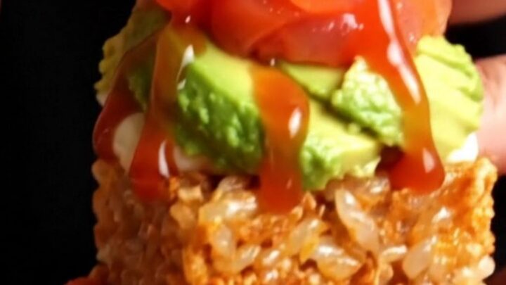 Golden crispy rice cakes topped with avocado, spicy salmon tartare, and jalapeño wheels