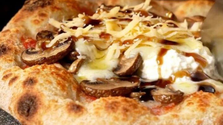 Golden crispy flatbread topped with bubbling fontina, sautéed wild mushrooms, and ricotta dollops