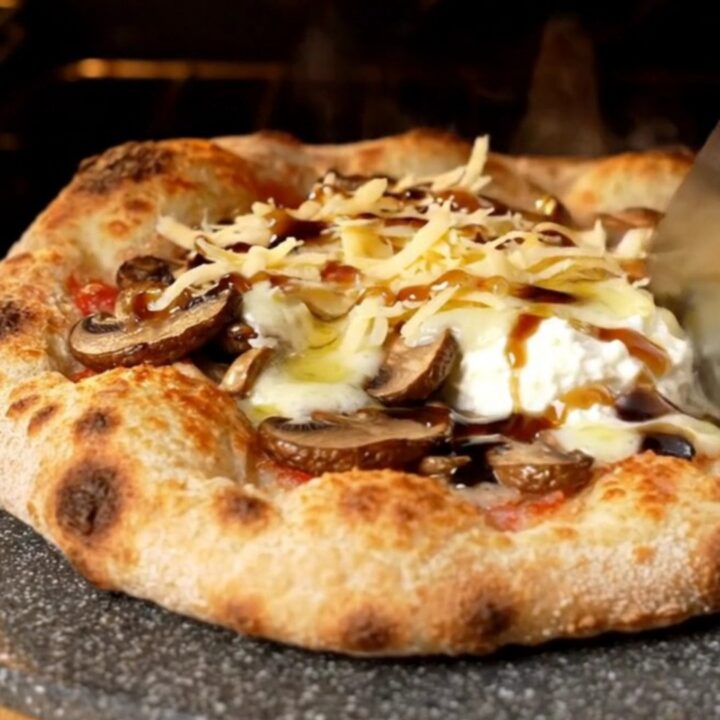 Golden crispy flatbread topped with bubbling fontina, sautéed wild mushrooms, and ricotta dollops