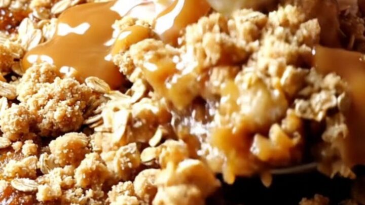 Cast iron skillet apple crisp with golden oat streusel, topped with vanilla ice cream and salted caramel drizzle.