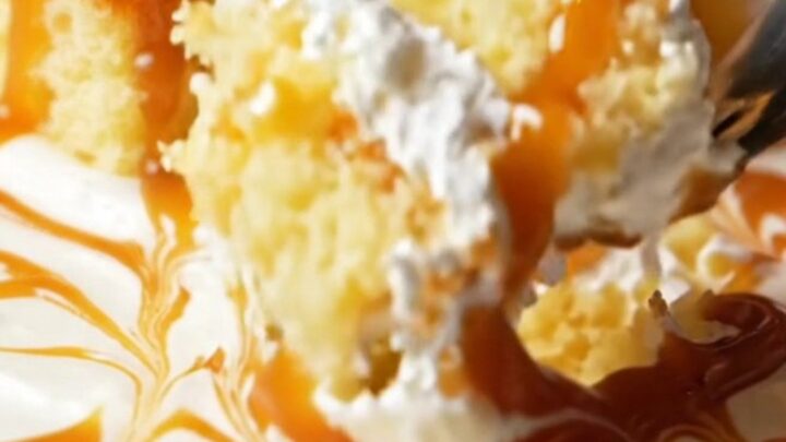 A square slice of Turkish Trileçe with caramel glaze and whipped cream layers