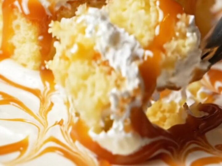 A square slice of Turkish Trileçe with caramel glaze and whipped cream layers