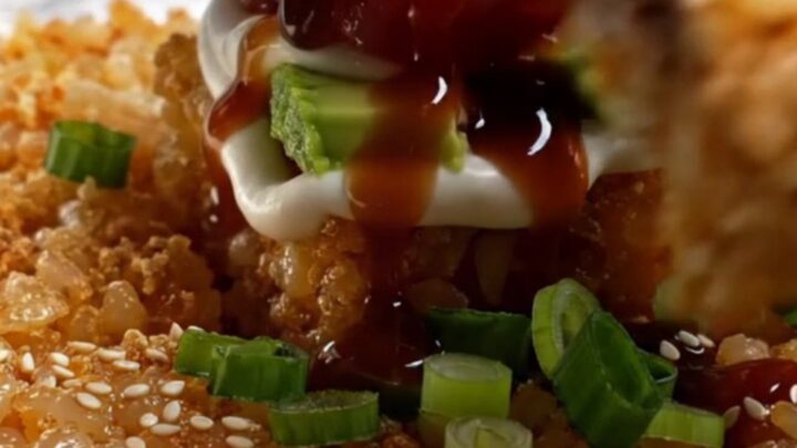 Golden crispy rice squares topped with spicy tuna tartare, avocado, and sweet soy drizzle
