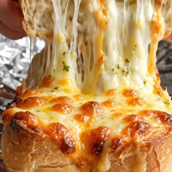 Pull-apart stuffed baguette with molten cheese stretch