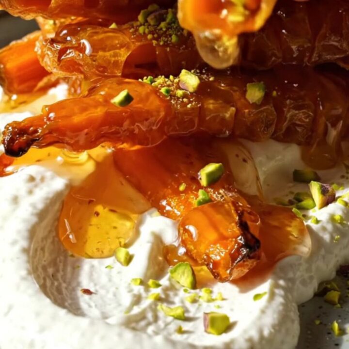 Crispy accordion carrots with whipped feta and hot honey on a ceramic platter