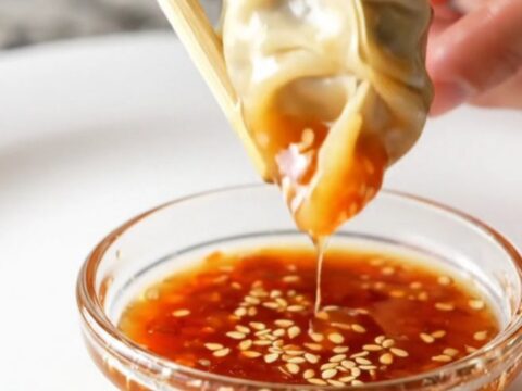 Golden lace skirt gyoza on a plate, crackling and crisp