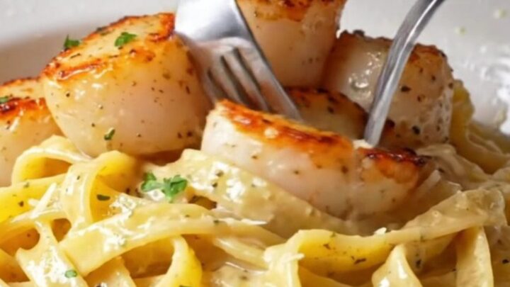 Creamy lemon garlic herb scallop pasta with golden seared scallops, fresh parsley