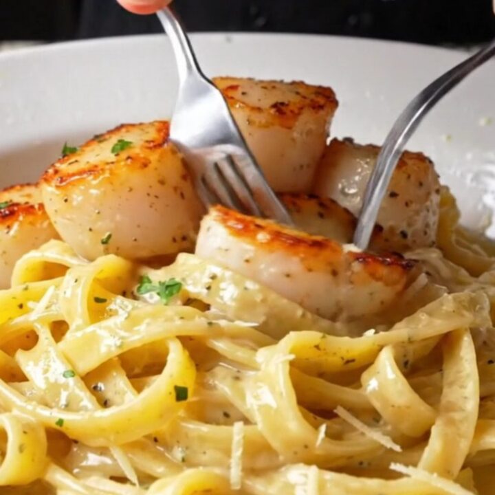 Creamy lemon garlic herb scallop pasta with golden seared scallops, fresh parsley