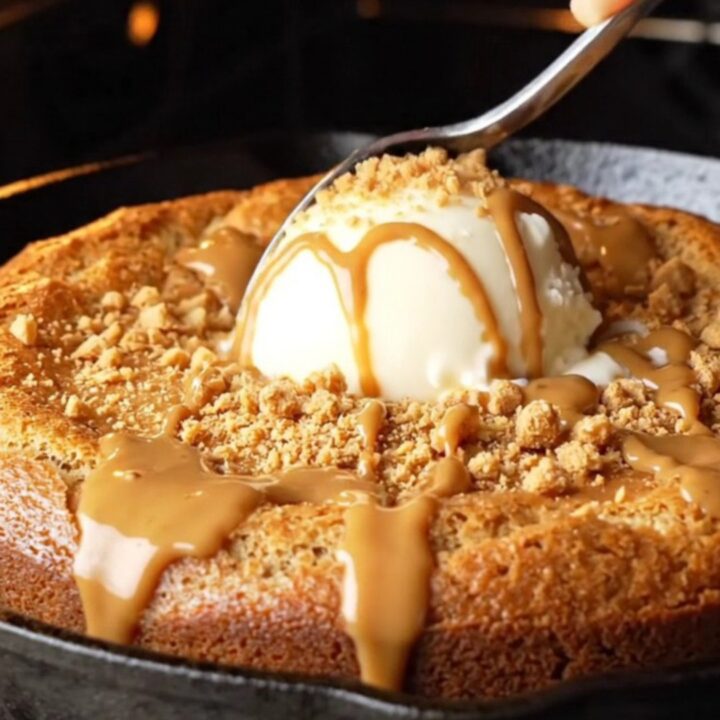 Molten Biscoff skillet cake with vanilla ice cream and cookie crumbs
