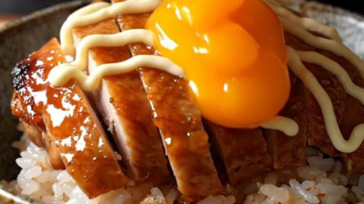 Crispy teriyaki chicken thighs sliced over rice with a jammy onsen egg and Kewpie mayo drizzle.