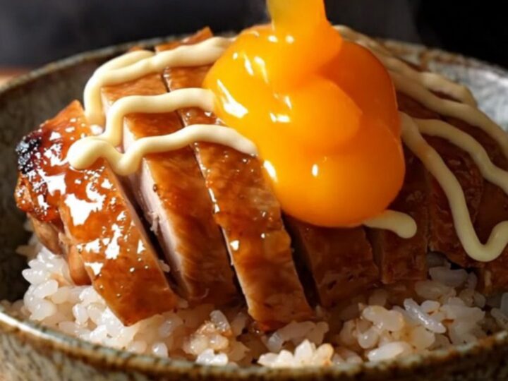 Crispy teriyaki chicken thighs sliced over rice with a jammy onsen egg and Kewpie mayo drizzle.