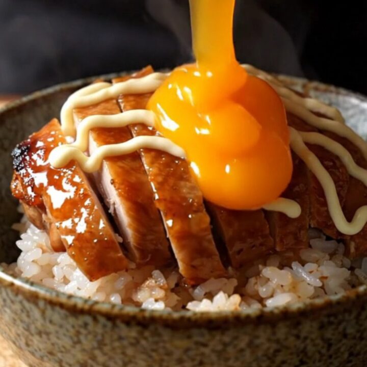Crispy teriyaki chicken thighs sliced over rice with a jammy onsen egg and Kewpie mayo drizzle.