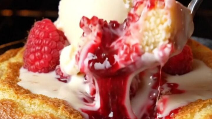 Molten white chocolate raspberry skillet lava cake with vanilla ice cream