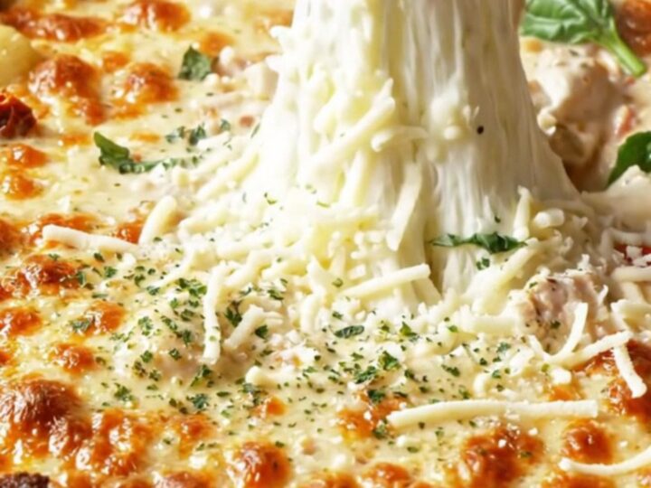 Golden-crusted chicken gnocchi bake in a skillet with melted mozzarella