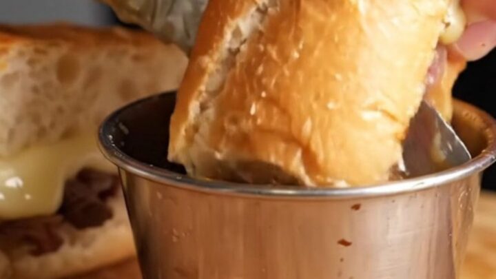 French Dip Roast Beef Skillet Sandwich with melted provolone and au jus for dipping