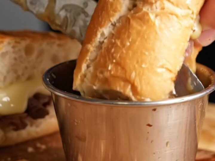 French Dip Roast Beef Skillet Sandwich with melted provolone and au jus for dipping
