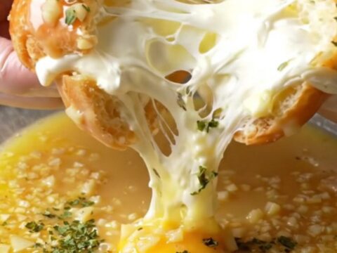 Golden toasted garlic bread buns with creamy filling oozing out