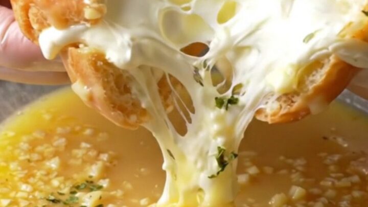 Golden toasted garlic bread buns with creamy filling oozing out