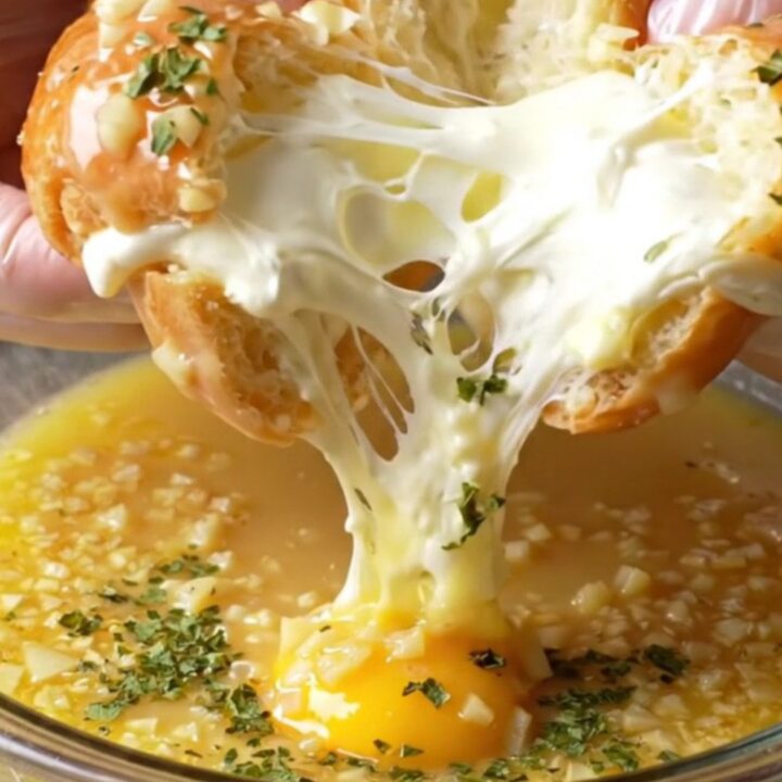 Golden toasted garlic bread buns with creamy filling oozing out