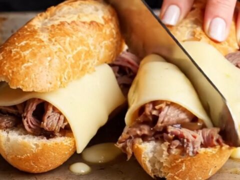 French dip baguette with roast beef, provolone, and au jus