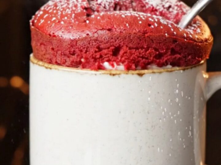 Red velvet mug cake with molten cream cheese center flowing out