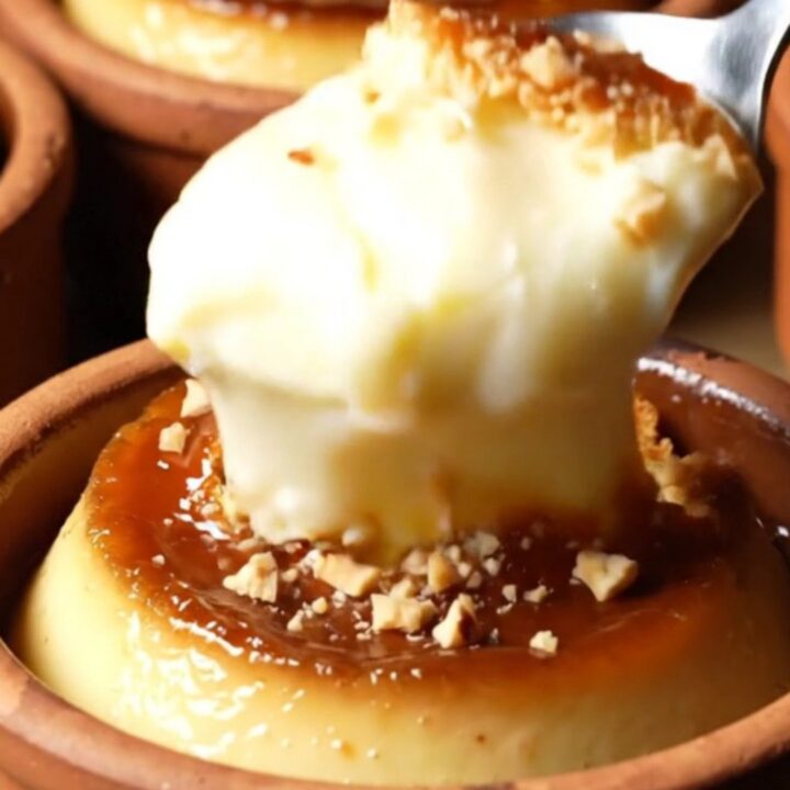 Caramelized baked milk pudding with blistered golden top and hazelnuts