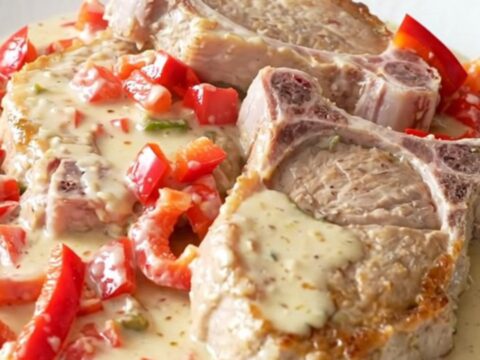 Slow cooker creamy pepper jack pork chops with red peppers in a creamy sauce