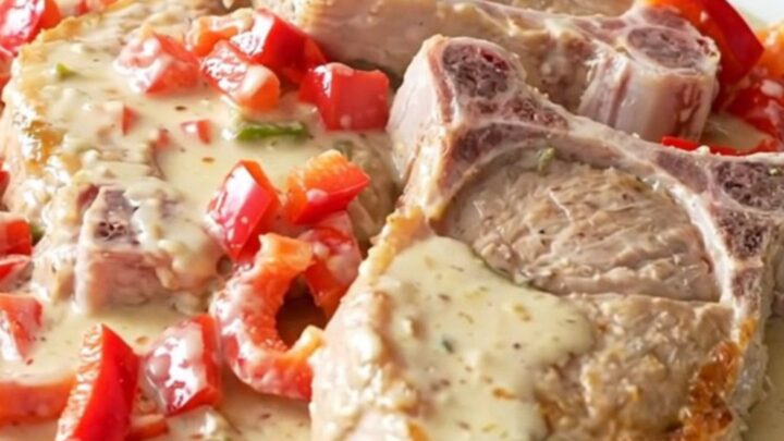 Slow cooker creamy pepper jack pork chops with red peppers in a creamy sauce
