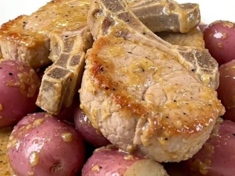 Tender pork chops and baby red potatoes in a creamy ranch sauce in a slow cooker