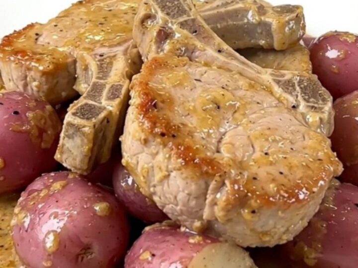 Tender pork chops and baby red potatoes in a creamy ranch sauce in a slow cooker