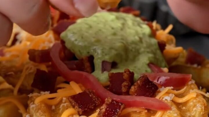 Loaded waffle fries with melted cheese, bacon, jalapeño-lime crema, and pickled red onions