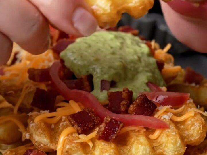 Loaded waffle fries with melted cheese, bacon, jalapeño-lime crema, and pickled red onions