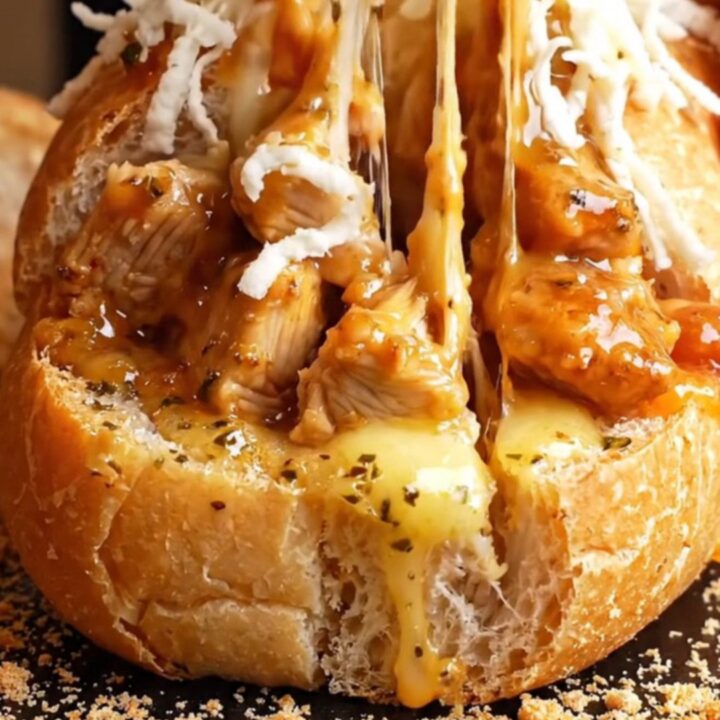Golden baguette stuffed with hot honey garlic chicken and melted mozzarella, sliced thick with cheese pull