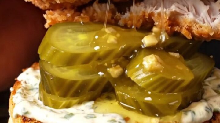 Crispy chicken sandwich with honey chipotle glaze, ranch, and pickles on a brioche bun